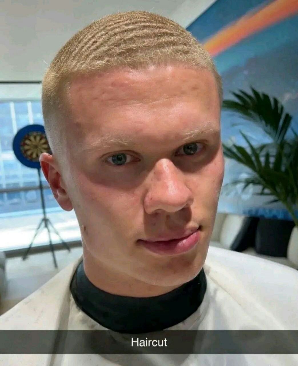 a man with a bald haircut in a barber